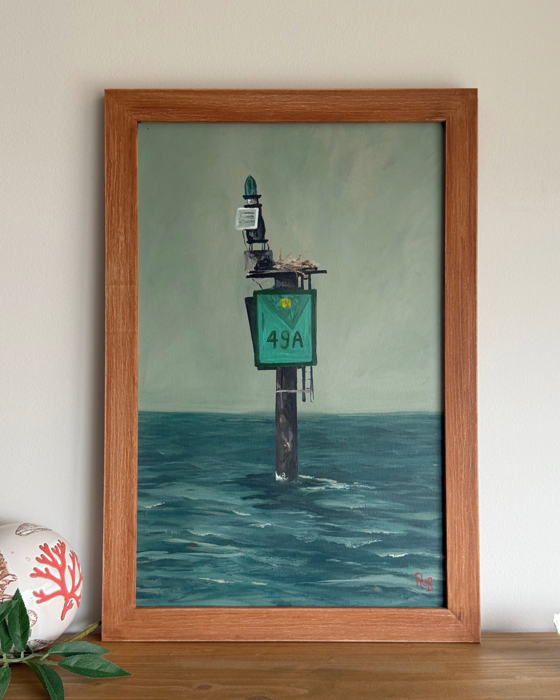 Framed painting of a mile marker in the bay.